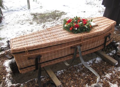 Wicker casket at grave site
